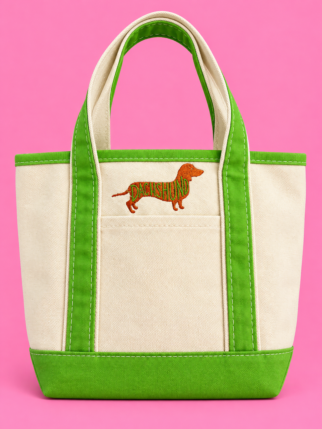Embroidered dachshund canvas tote on a pink background.