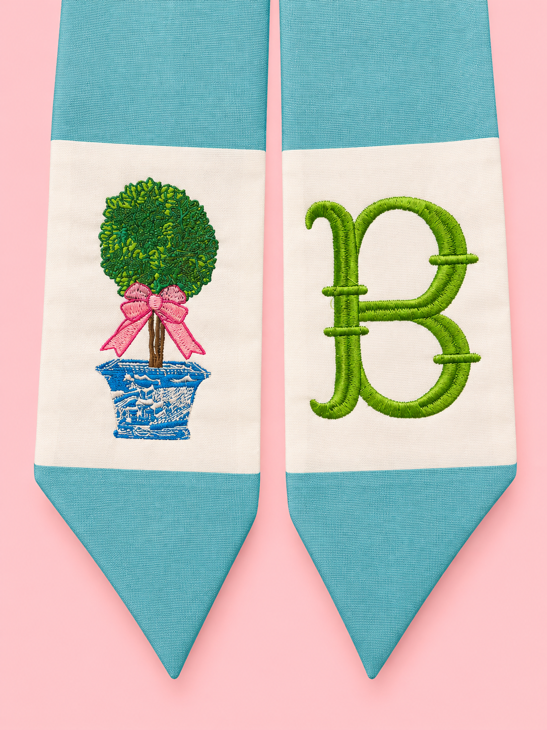 Aqua wreath sash with green B monogram and embroidered topiary on light pink